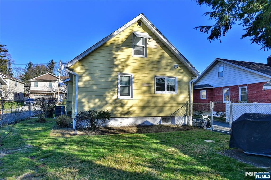 12-64 Burbank Street Fair Lawn, NJ 07410 - Photo 33 of 34 a view of house with a yard