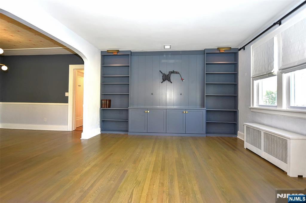 12-64 Burbank Street Fair Lawn, NJ 07410 - Photo 7 of 34 a view of a room with wooden floor and cabinet
