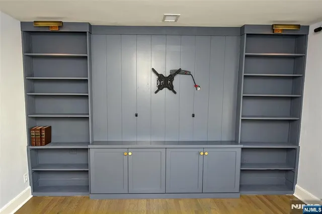 a view of a living room with a wooden floor