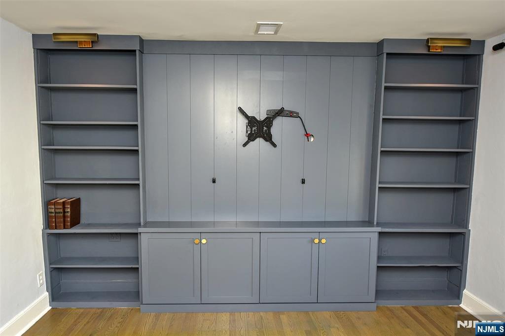 12-64 Burbank Street Fair Lawn, NJ 07410 - Photo 8 of 34 a view of walk in closet with empty racks