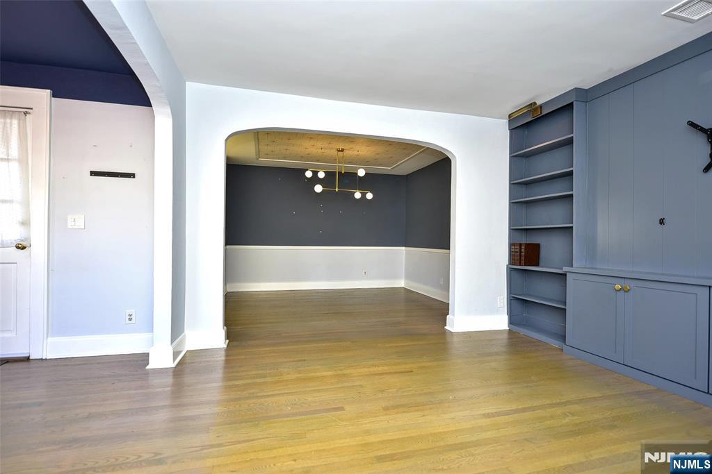 12-64 Burbank Street Fair Lawn, NJ 07410 - Photo 9 of 34 a view of a living room with a wooden floor