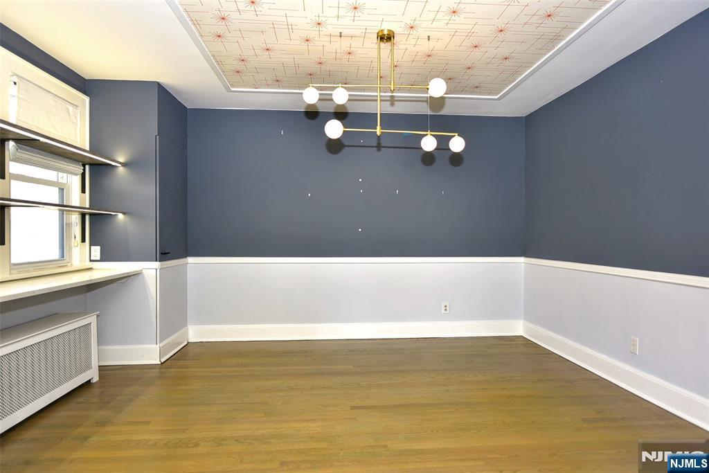 12-64 Burbank Street Fair Lawn, NJ 07410 - Photo 10 of 34 a view of cabinet and floor to ceiling window