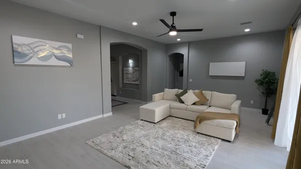 a living room with furniture and a rug
