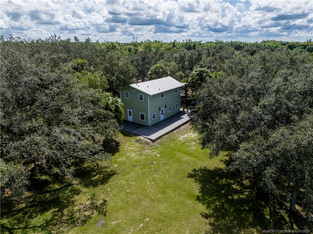 11809 Southwest Fox Brown Road Indiantown, FL 34956 - Photo 4 of 7 an aerial view of a house with a yard