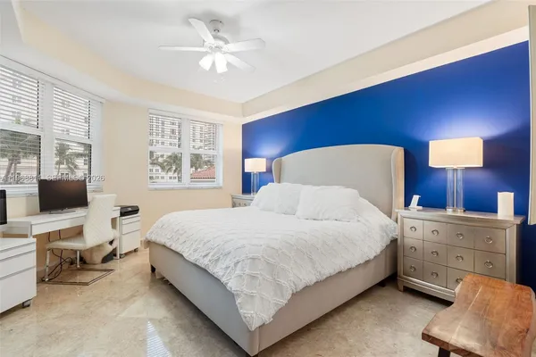 a bedroom with a bed and a couch
