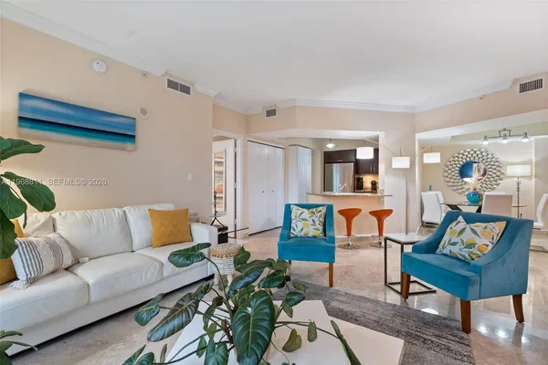 a living room with furniture and a rug