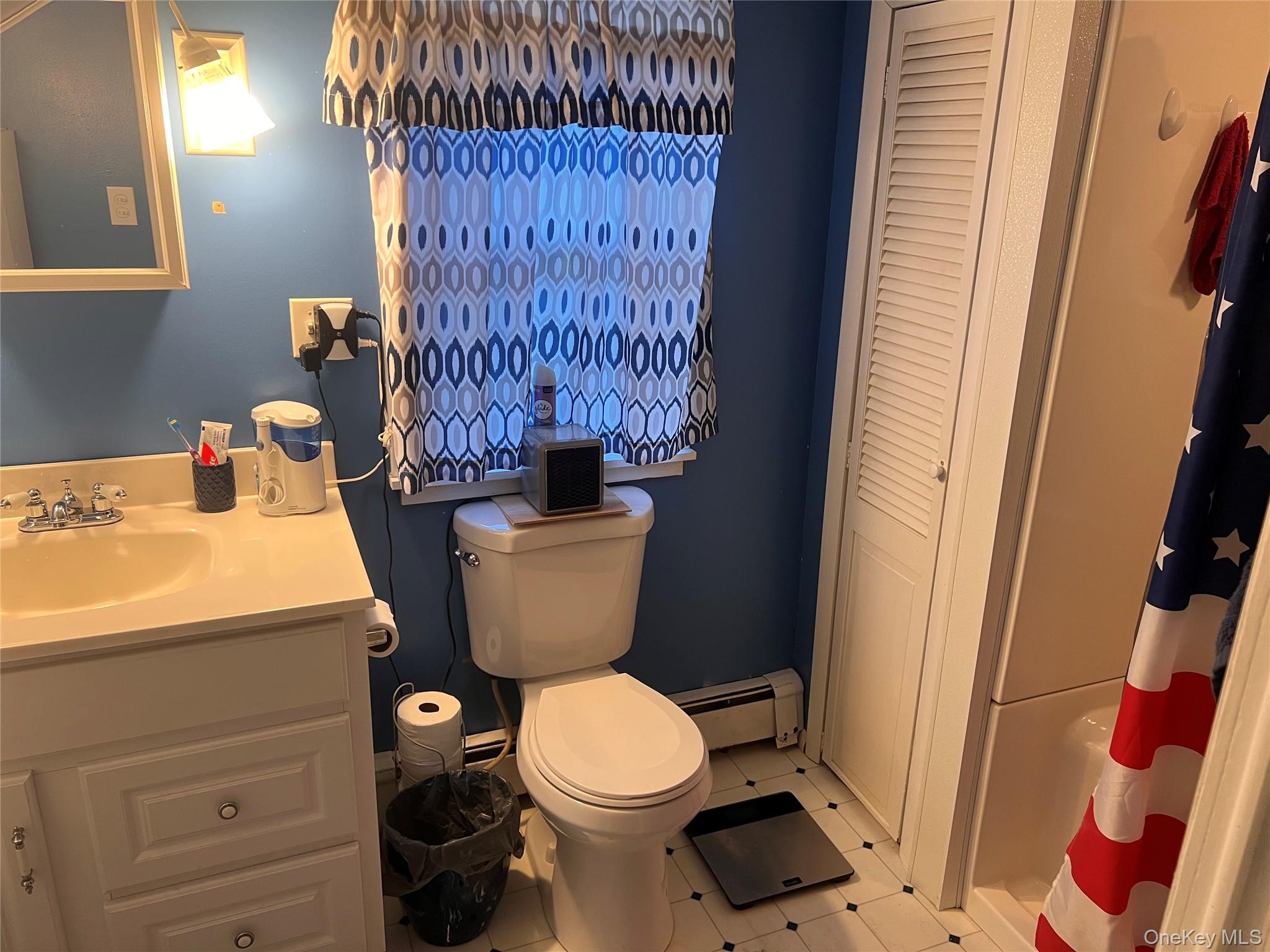 279 Cold Spring Road Monticello, NY 12701 - Photo 16 of 32 a bathroom with a toilet and a sink