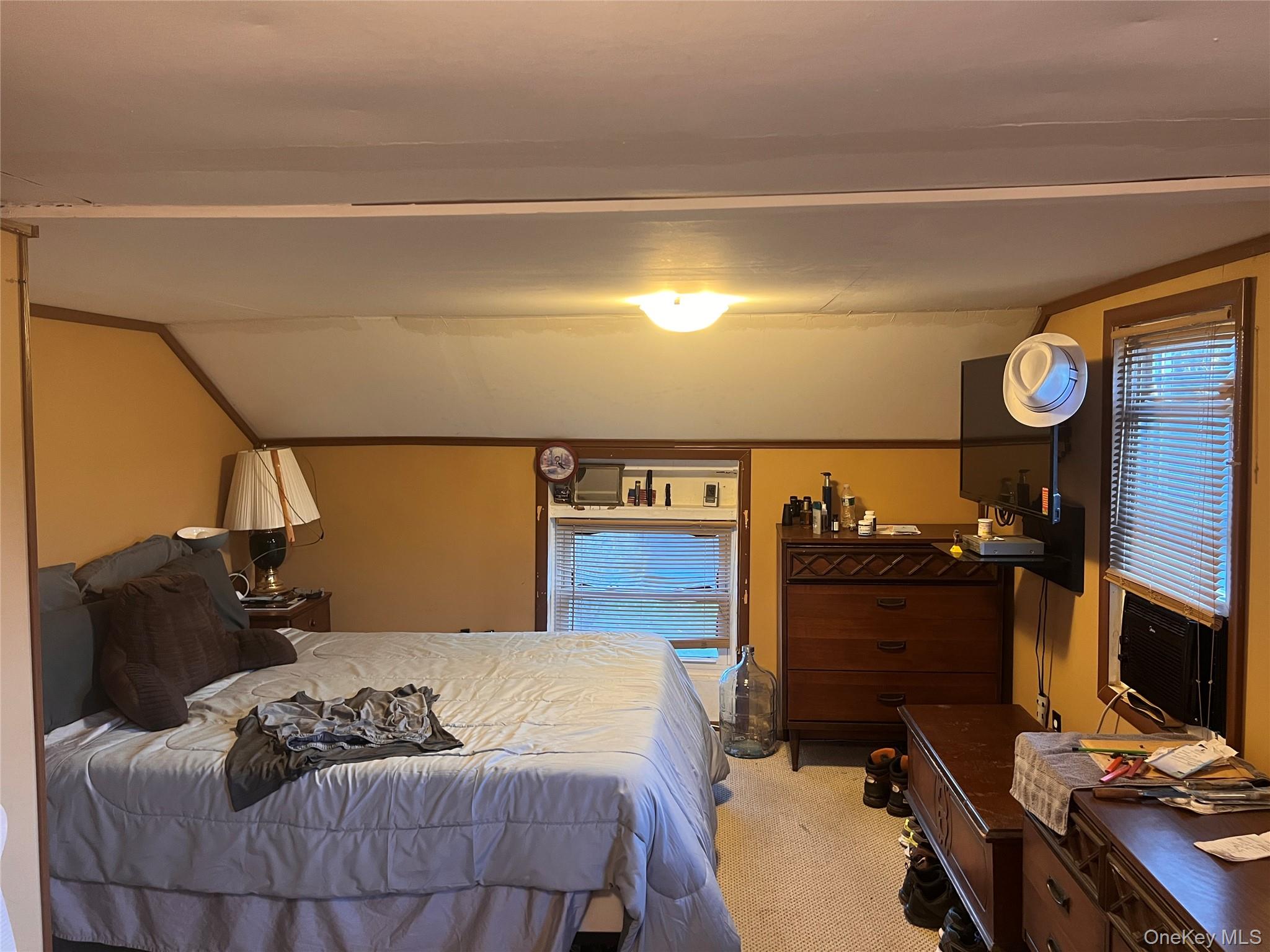 279 Cold Spring Road Monticello, NY 12701 - Photo 19 of 32 a bedroom with a bed and a television