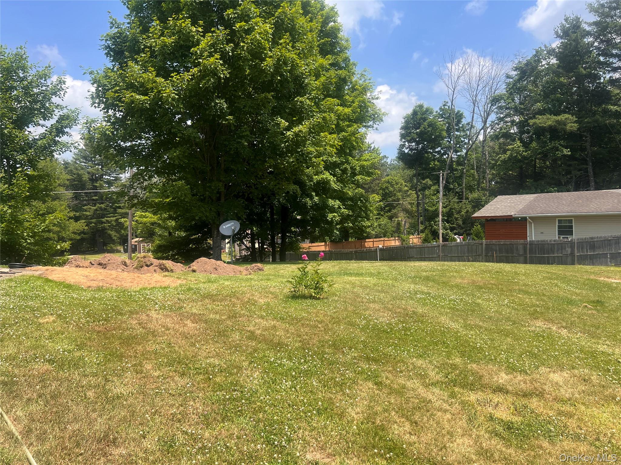 279 Cold Spring Road Monticello, NY 12701 - Photo 21 of 32 a swimming pool with wooden fence