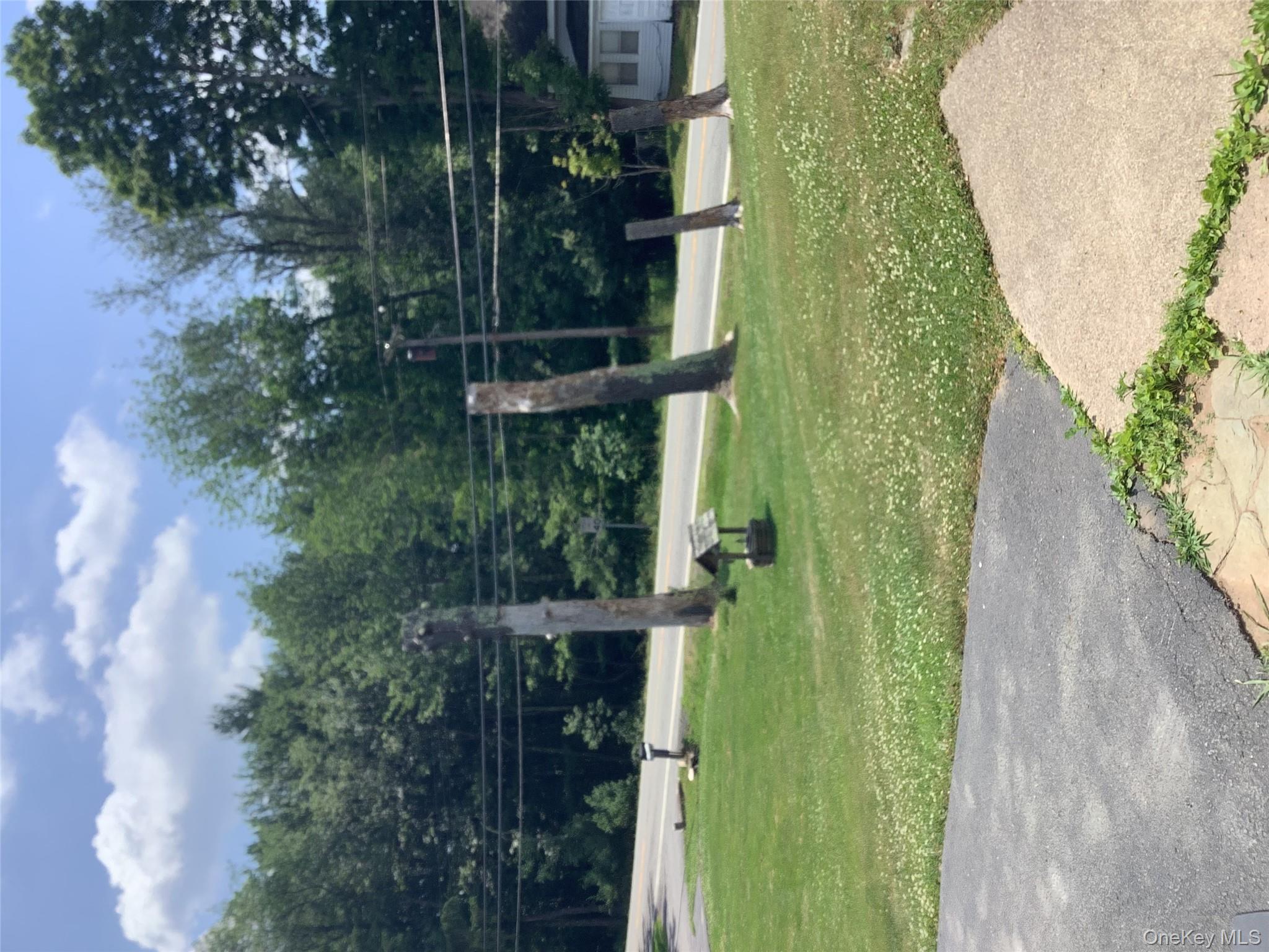 279 Cold Spring Road Monticello, NY 12701 - Photo 26 of 32 a view of a park with swings