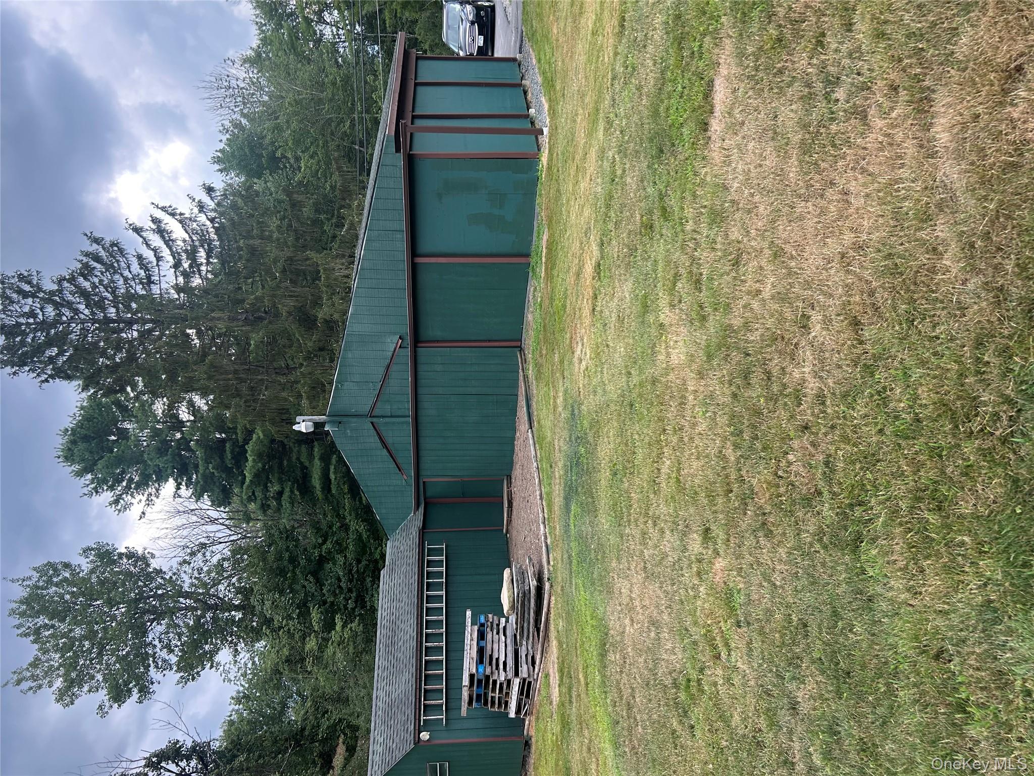 279 Cold Spring Road Monticello, NY 12701 - Photo 29 of 32 a view of swimming pool with an outdoor seating and yard