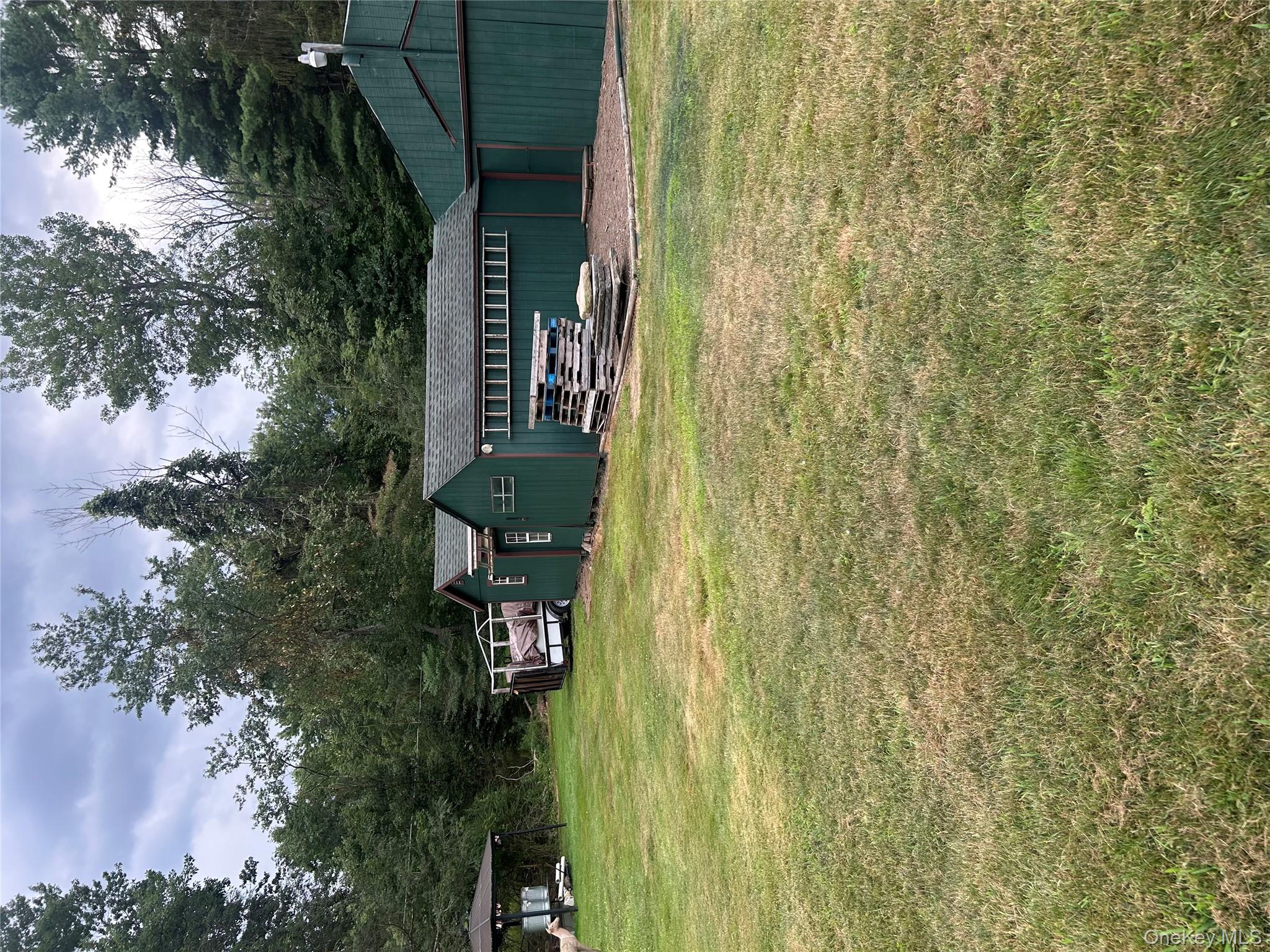 279 Cold Spring Road Monticello, NY 12701 - Photo 30 of 32 a view of a house with a yard