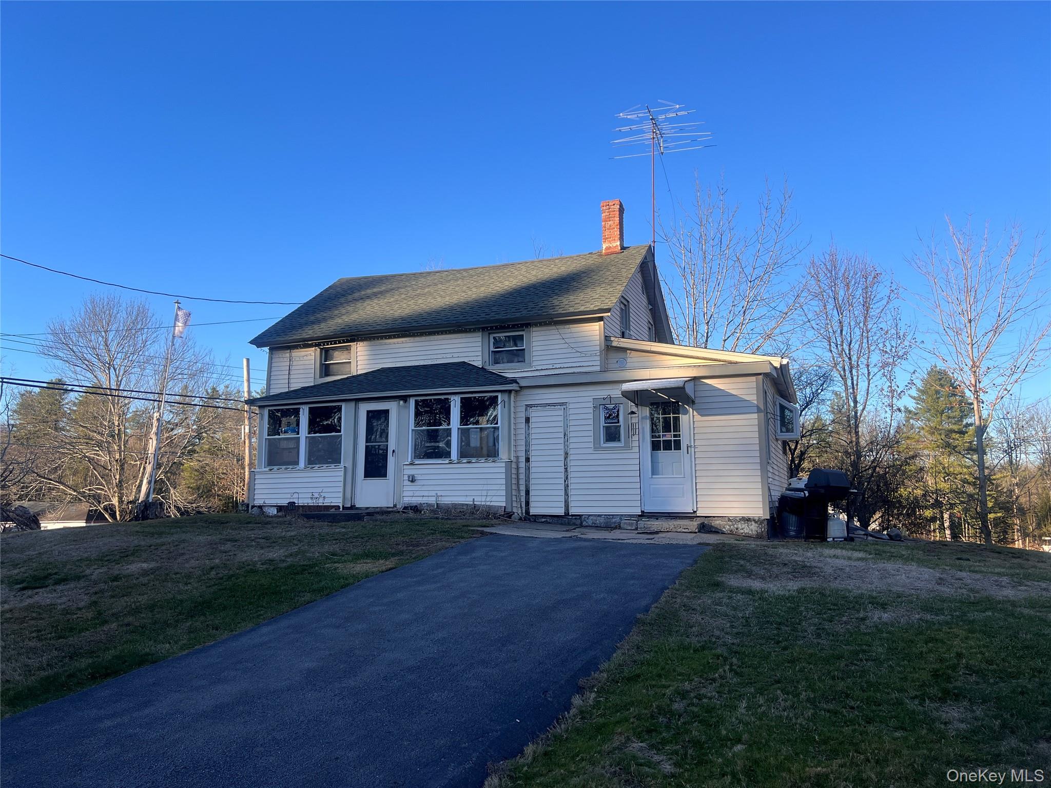 279 Cold Spring Road Monticello, NY 12701 - Photo 3 of 32 a front view of a house with a garden