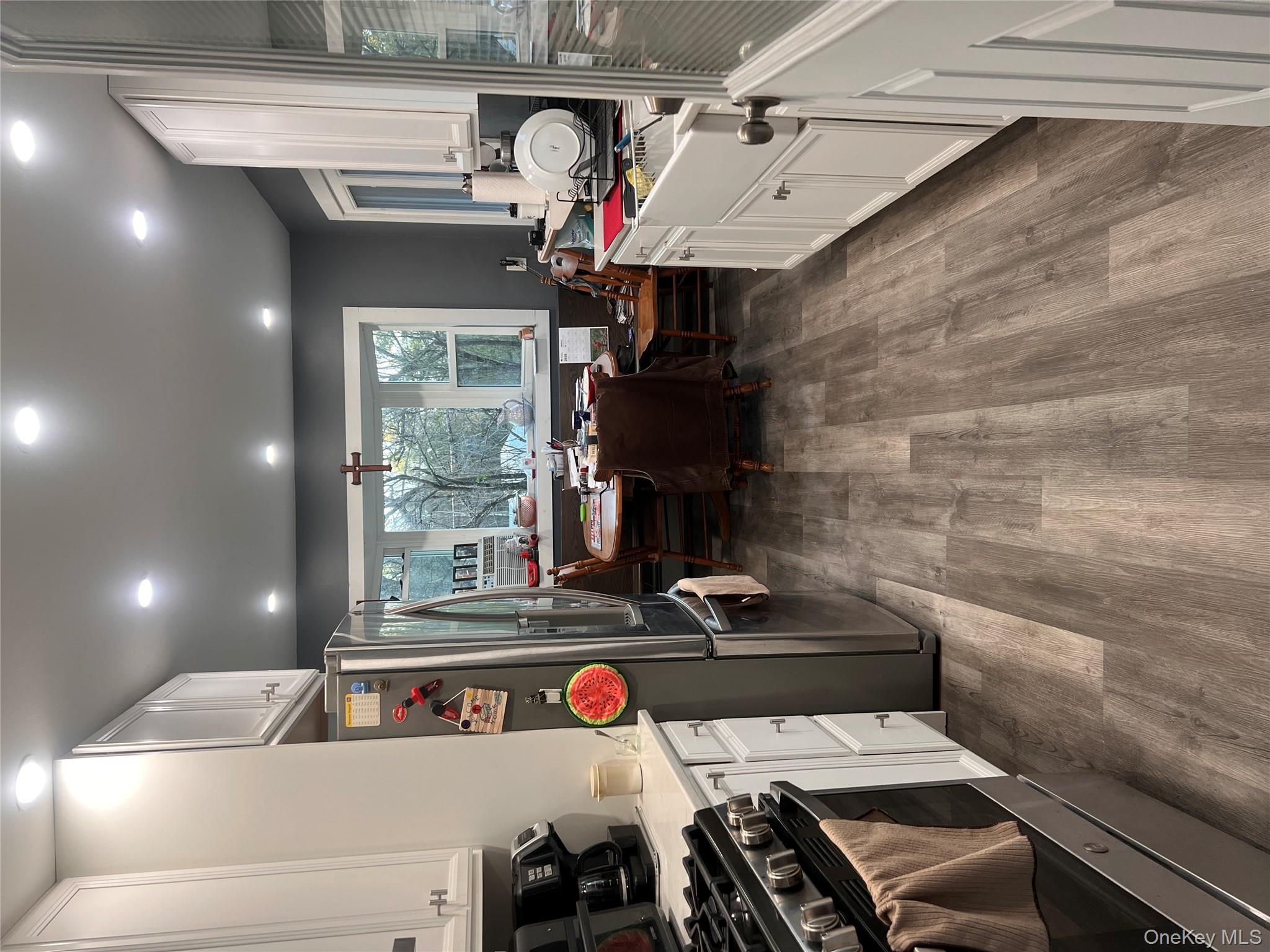 279 Cold Spring Road Monticello, NY 12701 - Photo 6 of 32 a kitchen with stainless steel appliances granite countertop a stove and a refrigerator