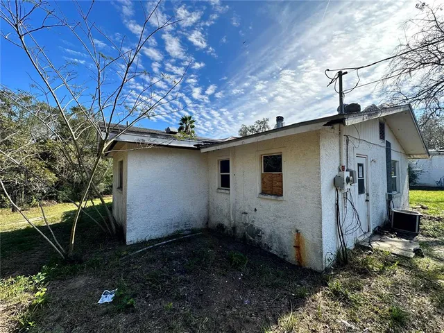 a view of a swimming pool with a yard