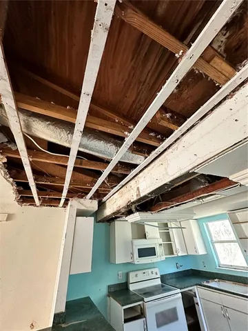 a view of an empty room with windows