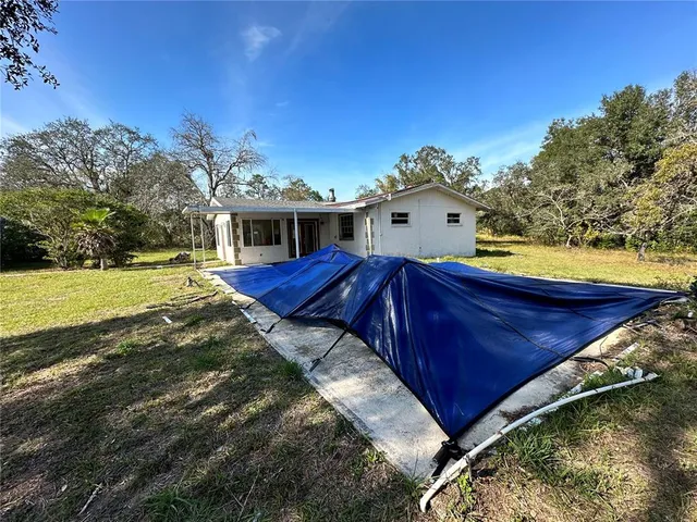 a house view with a backyard space