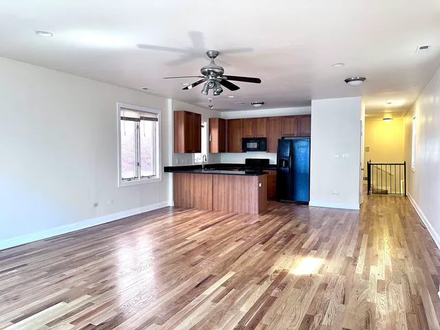 a view of a kitchen with a sink and a window