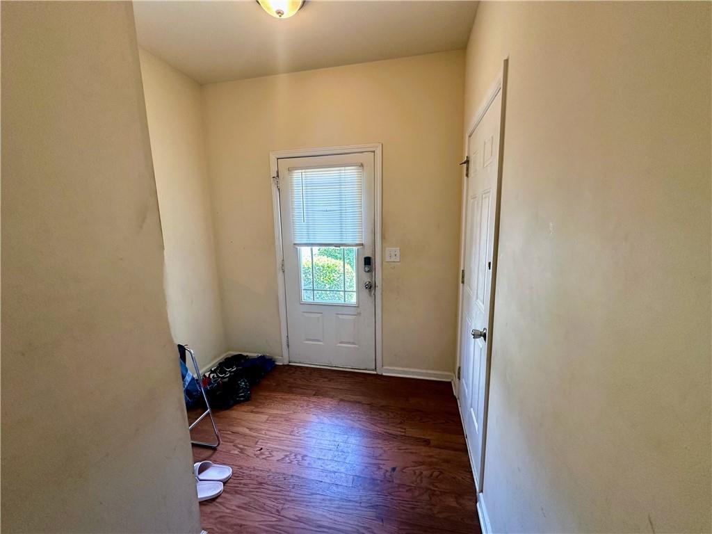 2655 Avanti Way Decatur, GA 30035 - Photo 2 of 12 an empty room with wooden floor and a window