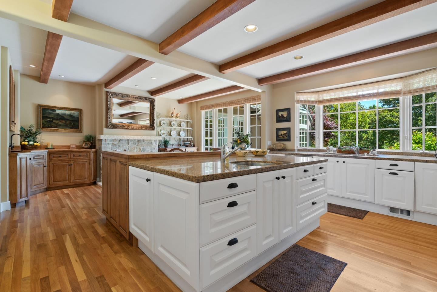 25951 Ridgewood Road Carmel, CA 93923 - Photo 11 of 32 a kitchen with granite countertop a sink and cabinets