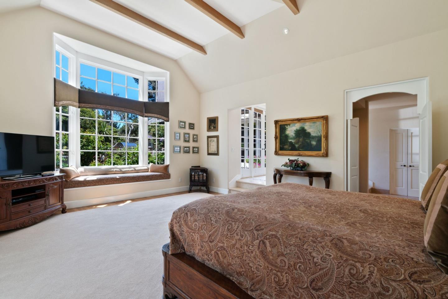 25951 Ridgewood Road Carmel, CA 93923 - Photo 17 of 32 a living room with a flat screen tv and a large window