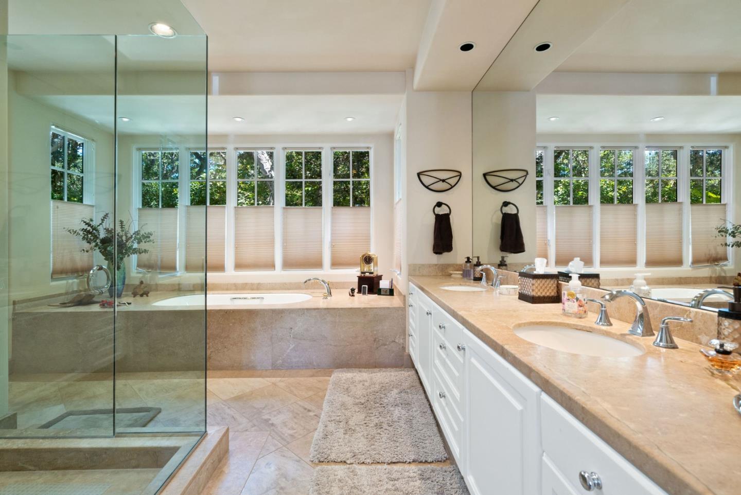25951 Ridgewood Road Carmel, CA 93923 - Photo 19 of 32 a large kitchen with kitchen island a large window a sink and cabinets