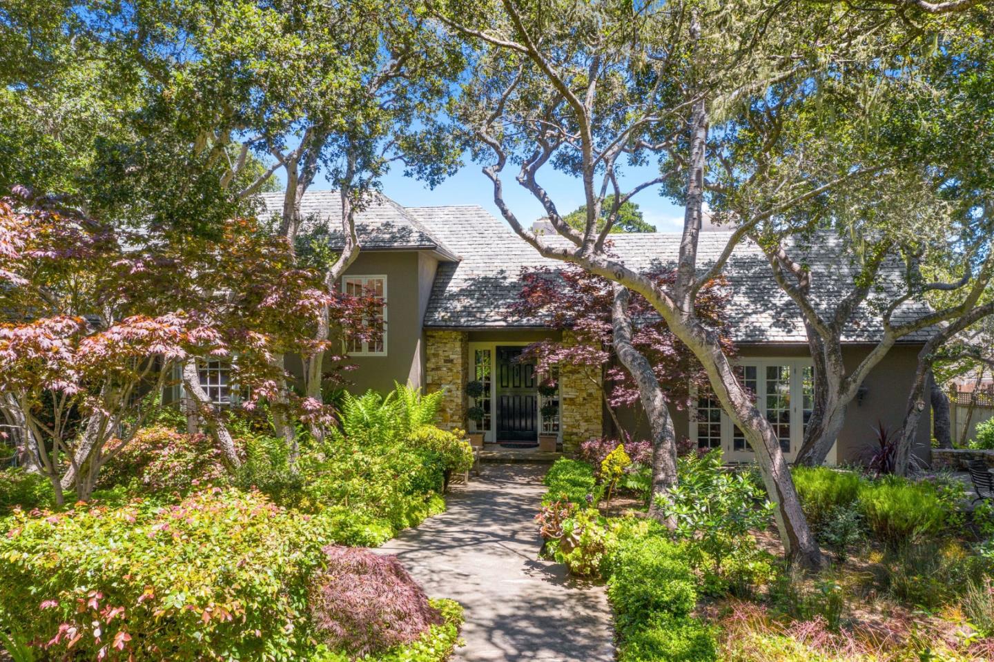 25951 Ridgewood Road Carmel, CA 93923 - Photo 2 of 32 front view of a house with a tree