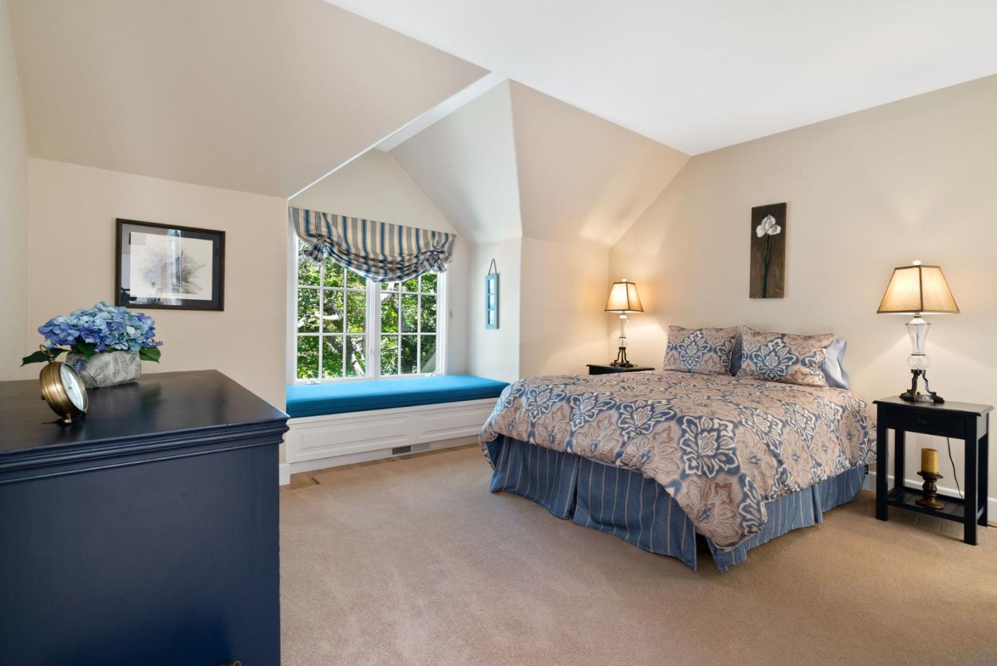 25951 Ridgewood Road Carmel, CA 93923 - Photo 24 of 32 a bedroom with a bed and window