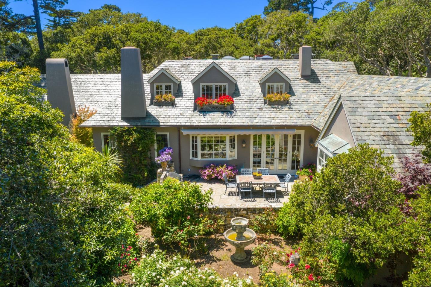 25951 Ridgewood Road Carmel, CA 93923 - Photo 28 of 32 a front view of a house with garden