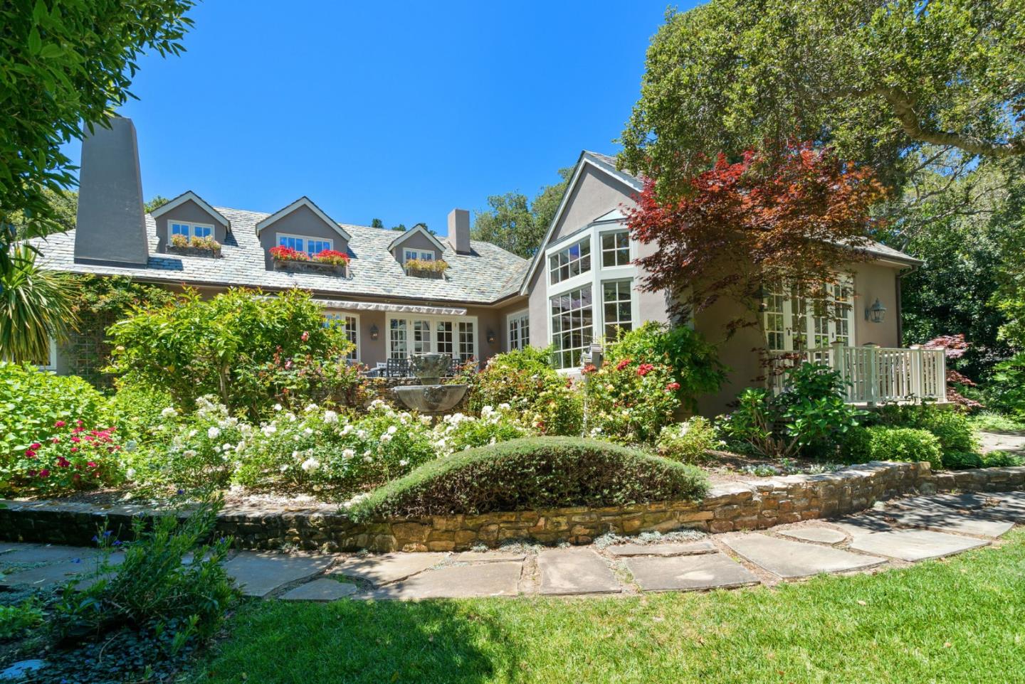 25951 Ridgewood Road Carmel, CA 93923 - Photo 3 of 32 a front view of a house with a yard