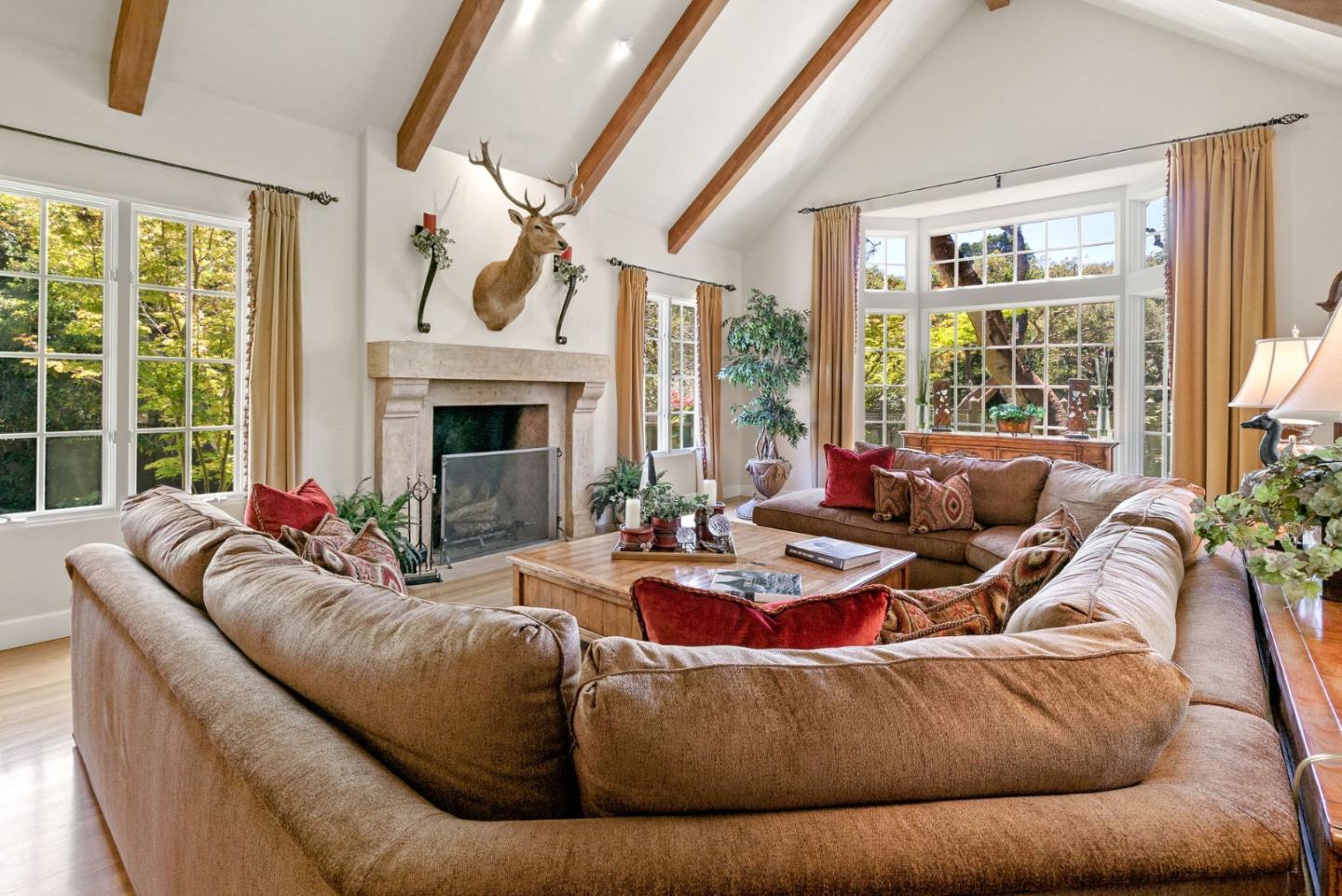 25951 Ridgewood Road Carmel, CA 93923 - Photo 9 of 32 a living room with furniture fireplace and floor to ceiling windows
