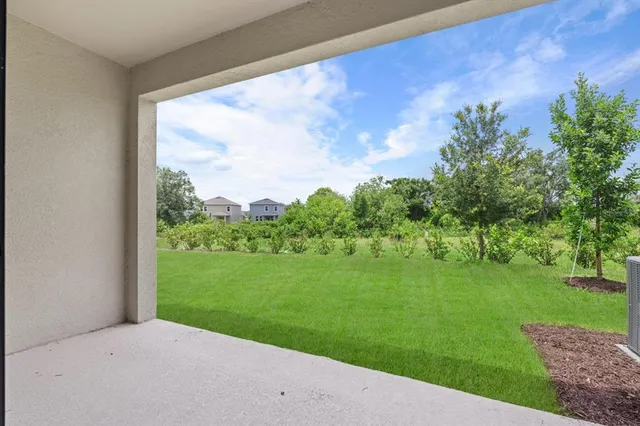 a backyard of a house with lots of green space