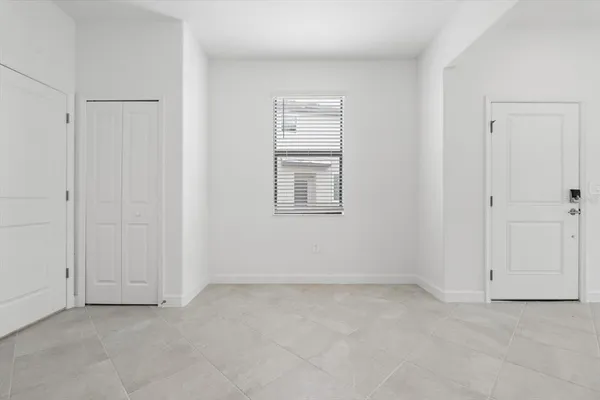 a view of an empty room with a window