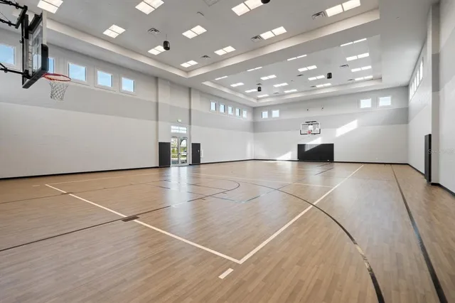 an empty room with gym equipment and a large window