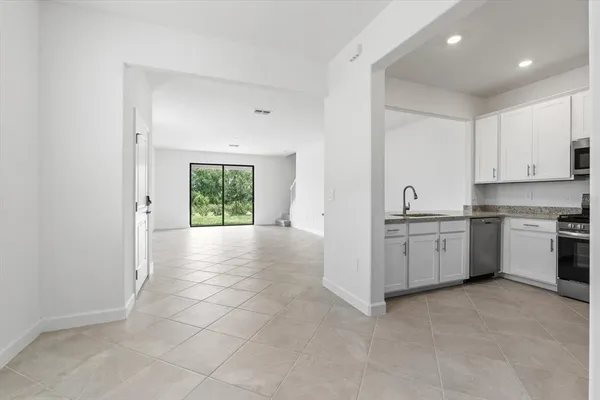 a view of a kitchen with electric appliances