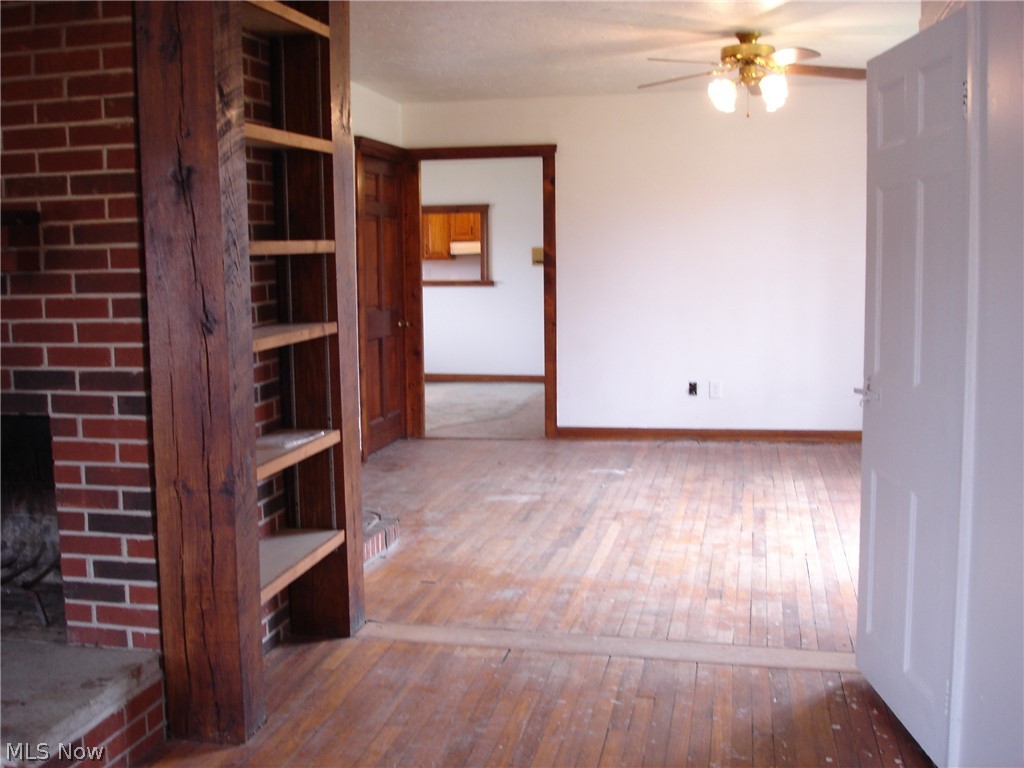 9733 Madison Road Montville, OH 44064 - Photo 14 of 31 Hard wood floors need some tlc but will be beautiful!