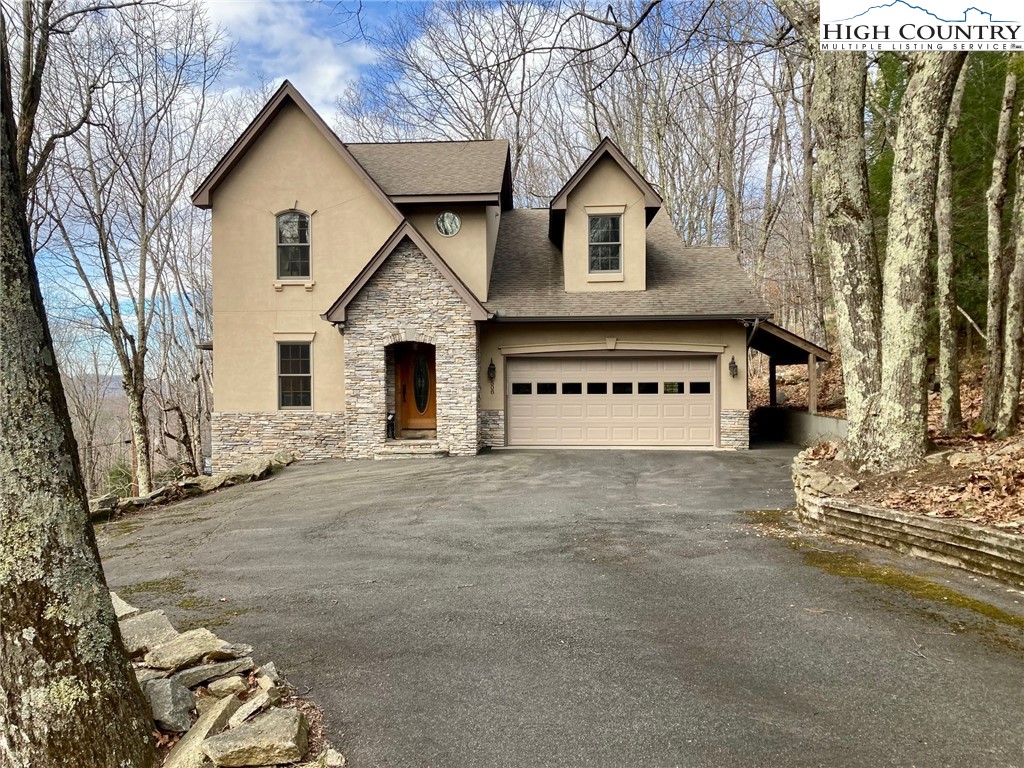 508 St Andrews Road Beech Mountain, NC 28604 - Photo 1 of 13 front view of a house with a yard