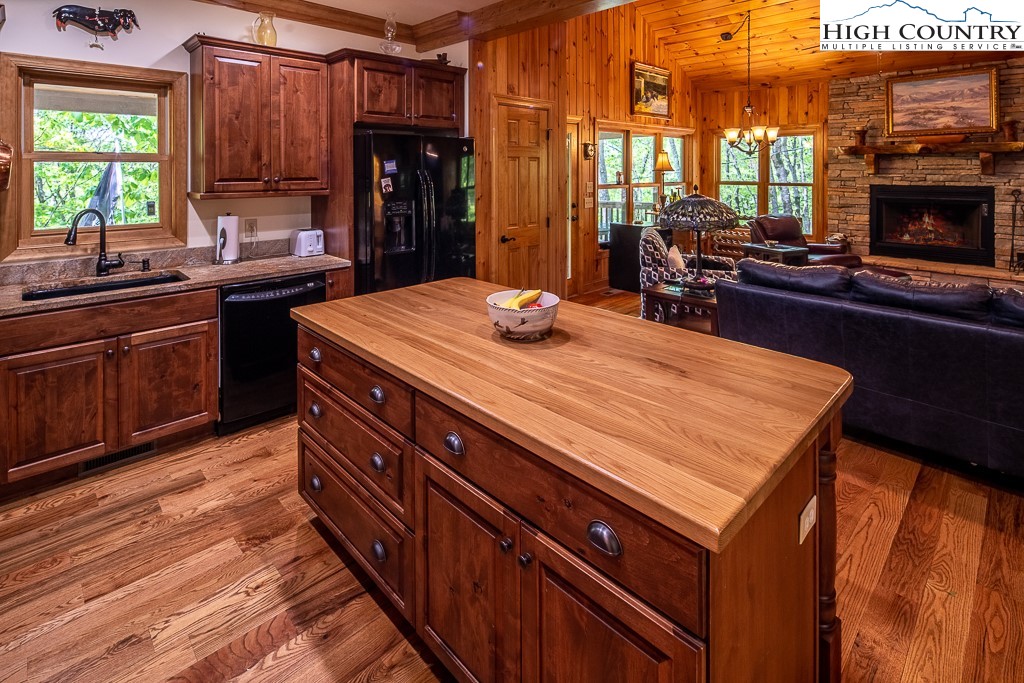 508 St Andrews Road Beech Mountain, NC 28604 - Photo 3 of 13 a kitchen with a sink and cabinets