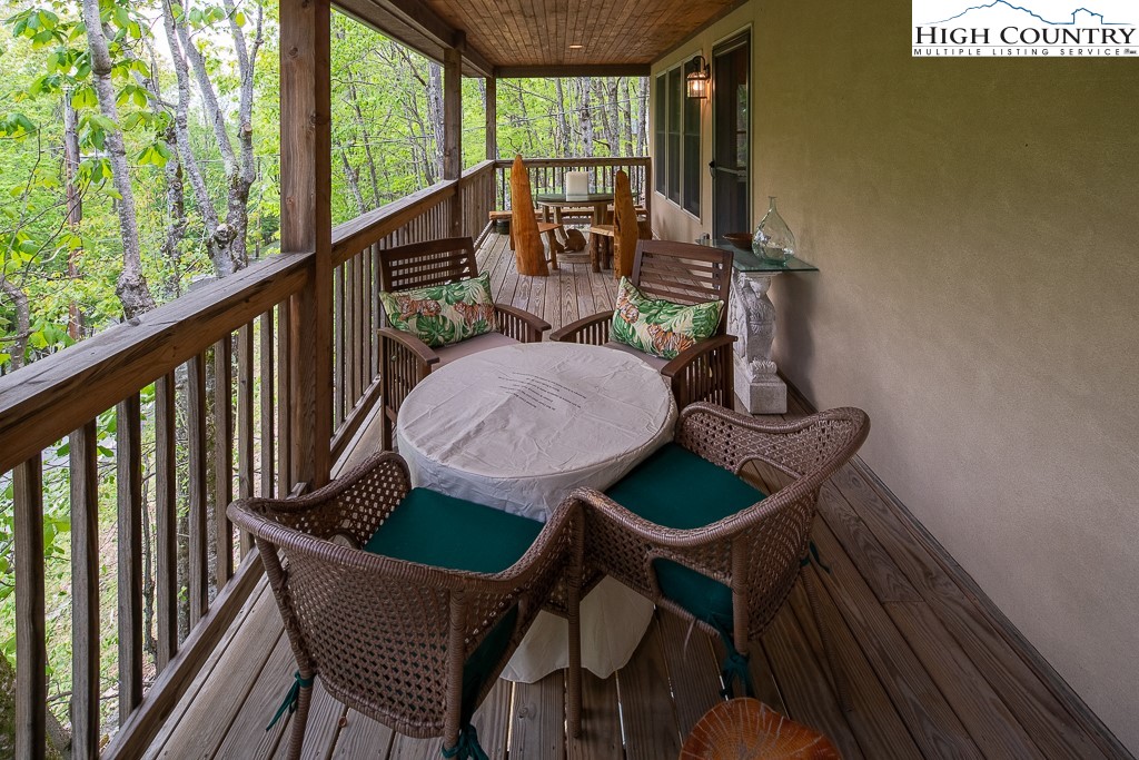 508 St Andrews Road Beech Mountain, NC 28604 - Photo 7 of 13 a view of balcony with a dining table and chairs