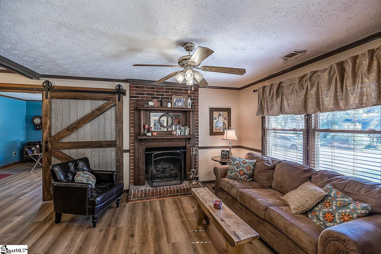8 Clearfield Road Greenville, SC 29607 - Photo 7 of 32 View of fireplace in family room