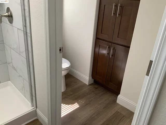 a view of a bathroom from a hallway