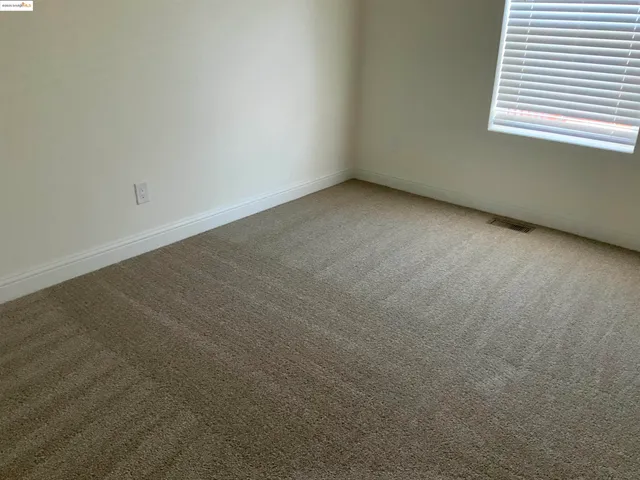 a view of a room that has a window in it