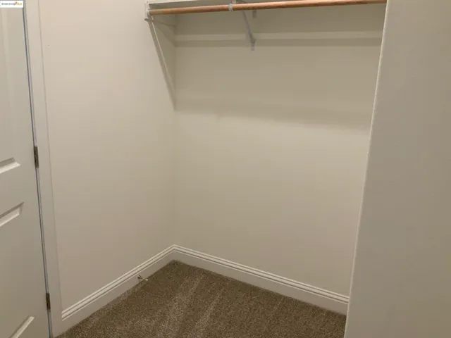 a bathroom with a granite countertop sink a toilet and bathtub