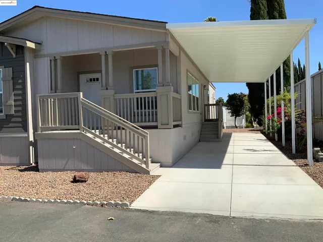 a view of balcony with furniture