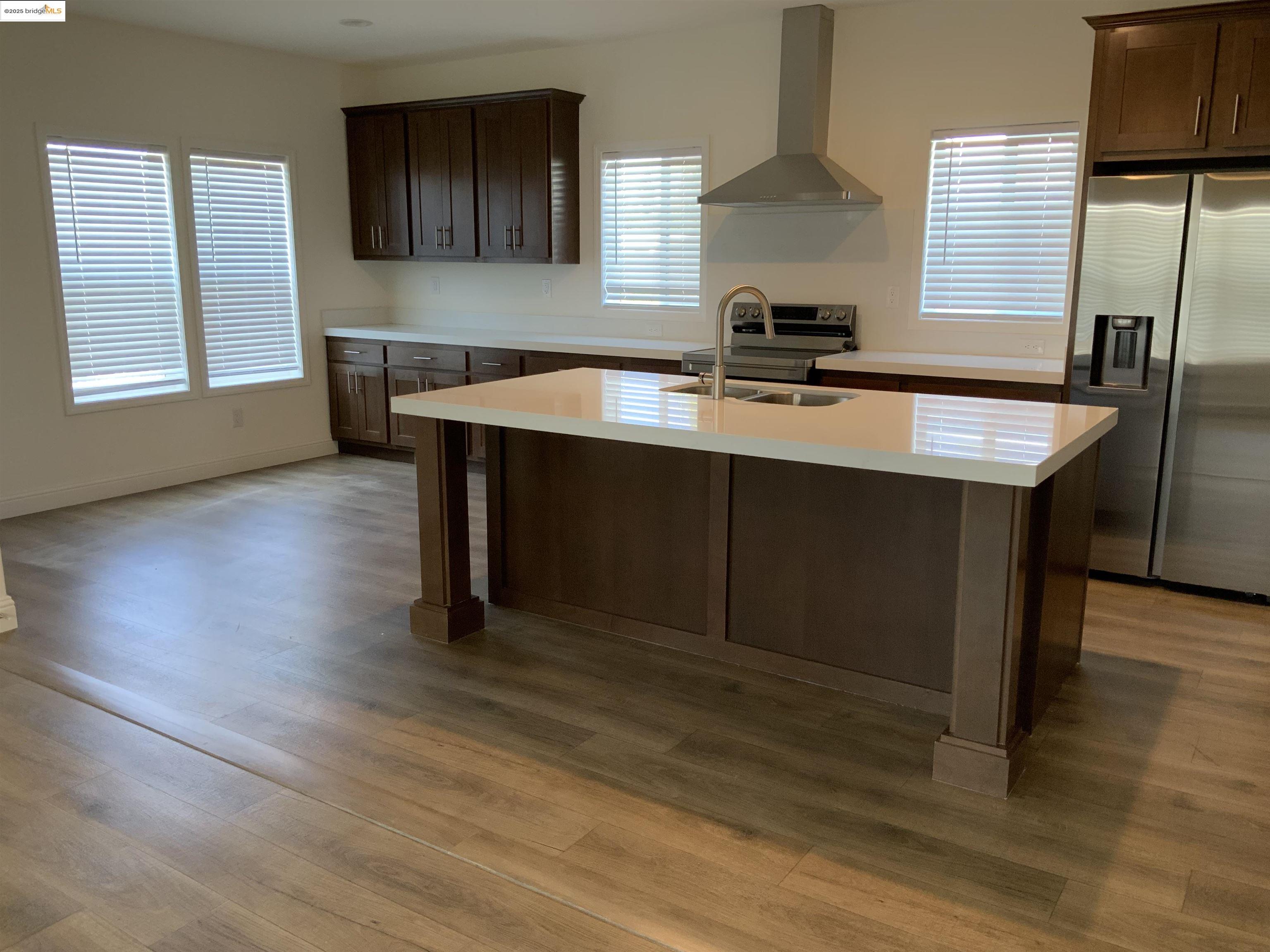 77 Hilo Drive Pittsburg, CA 94565 - Photo 5 of 23 a room with wooden floor table and chairs