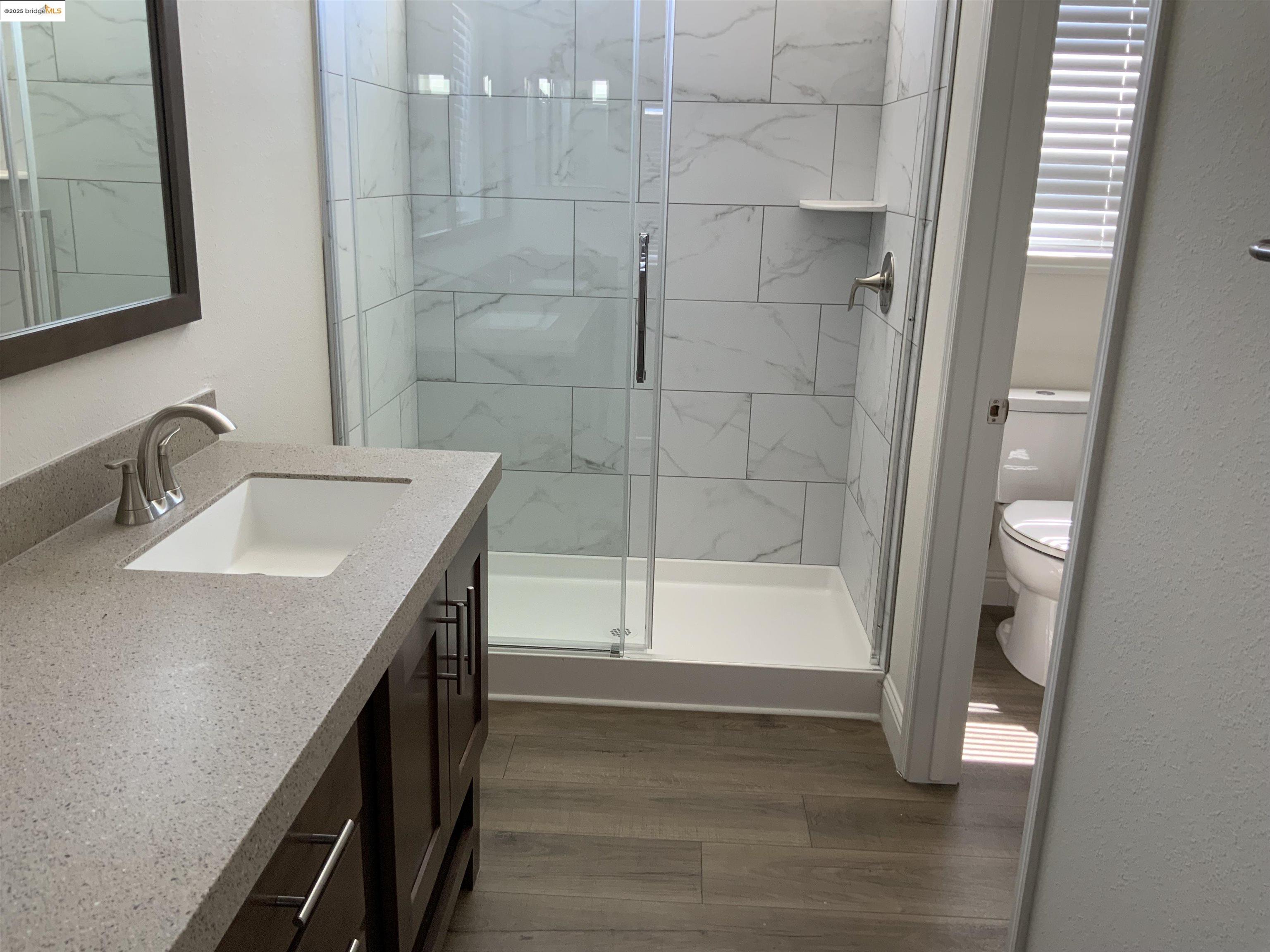 77 Hilo Drive Pittsburg, CA 94565 - Photo 10 of 23 a bathroom with a sink a toilet and shower