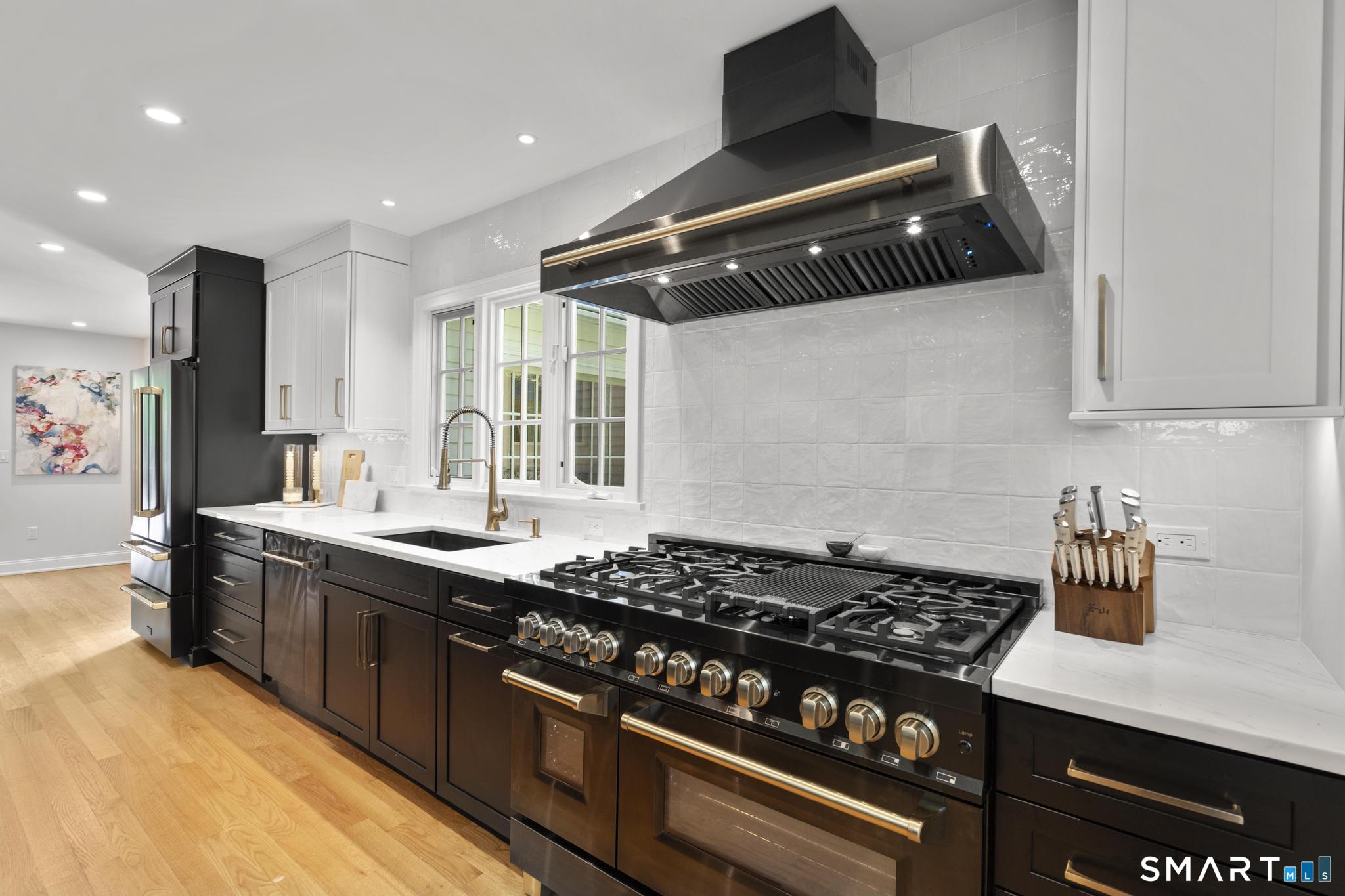 181 Old Branchville Road Ridgefield, CT 06877 - Photo 13 of 40 a kitchen with a stove and a sink