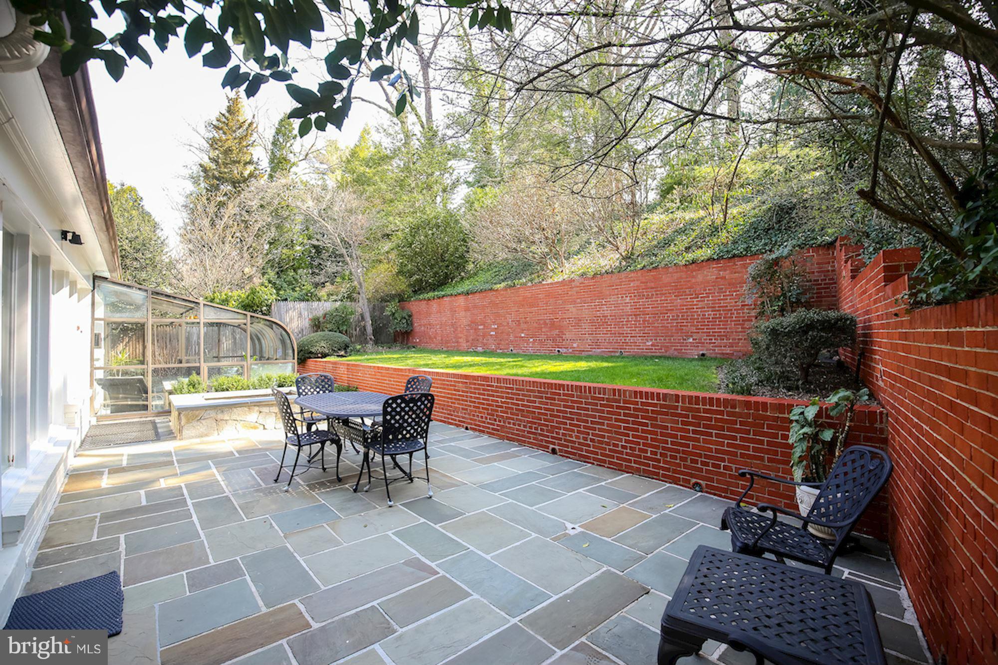 2347 49th Street Northwest Washington, DC 20007 - Photo 11 of 29 a view of a patio with a table and chairs