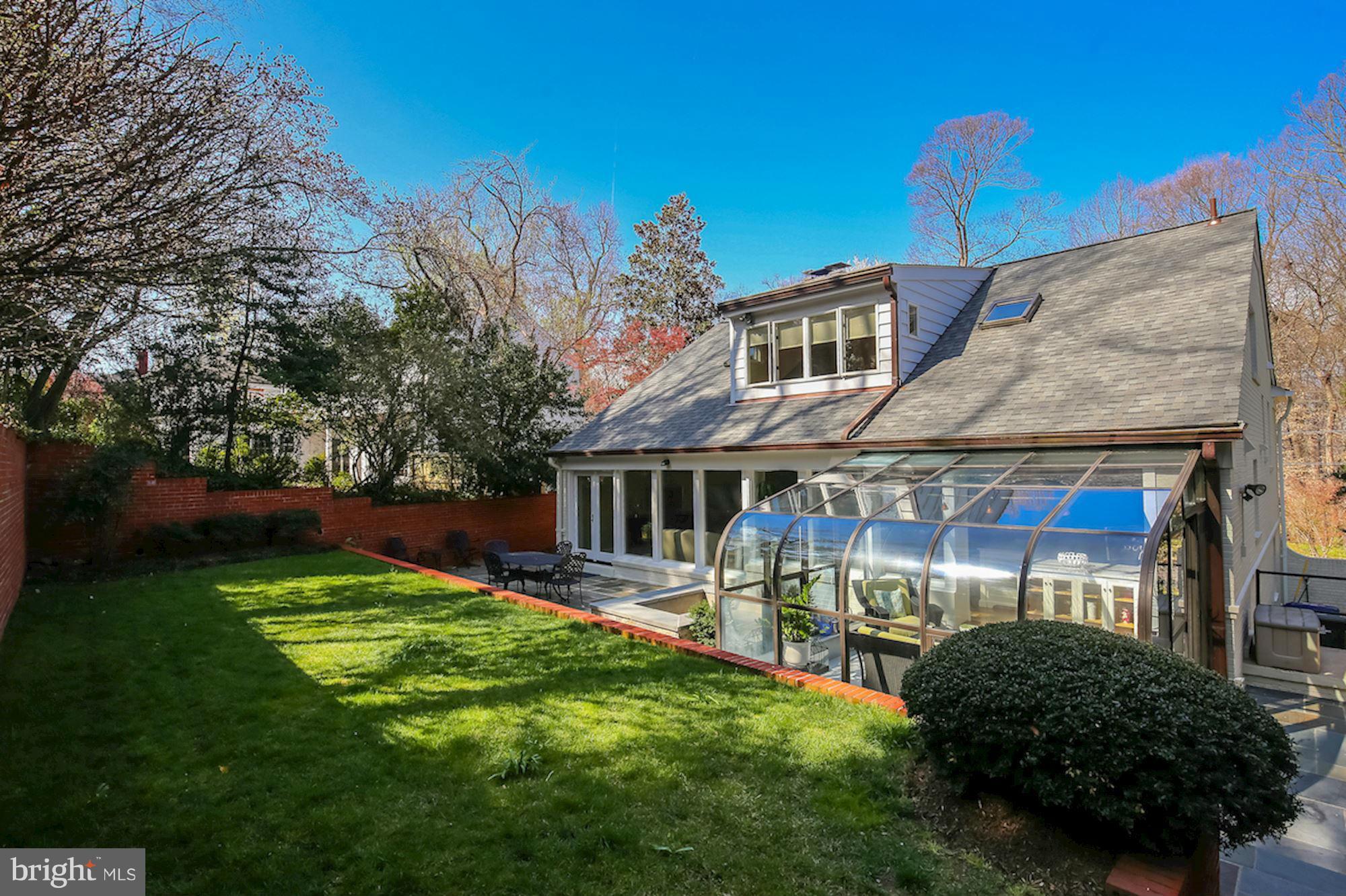 2347 49th Street Northwest Washington, DC 20007 - Photo 14 of 29 a backyard of a house with yard and outdoor seating