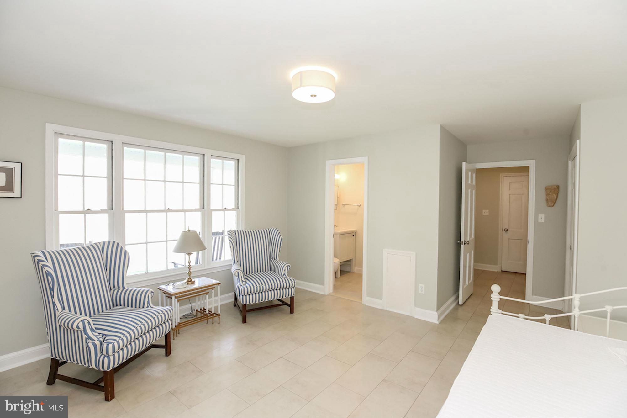 2347 49th Street Northwest Washington, DC 20007 - Photo 25 of 29 a living room with furniture and a large window